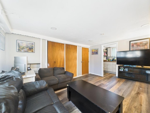 554 S 8th St, Lindenhurst, NY 11757 - living room with wood finished floors