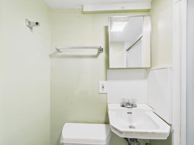 554 S 8th St, Lindenhurst, NY 11757 - bathroom featuring a sink and toilet