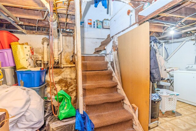 43 Westbury Ave, Mineola, NY 11501 - unfinished below grade area featuring washer / clothes dryer and stairs