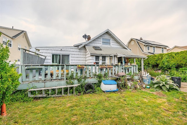 43 Westbury Ave, Mineola, NY 11501 - rear view of property with a lawn, a wooden deck, and a chimney