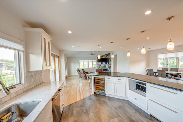 714 Montauk, West Islip, NY 11795 - kitchen featuring beverage cooler, appliances with stainless steel finishes, open floor plan, recessed lighting, and plenty of natural light