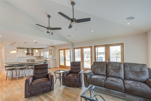 714 Montauk, West Islip, NY 11795 - living area featuring lofted ceiling, light wood-style flooring, a ceiling fan, and recessed lighting