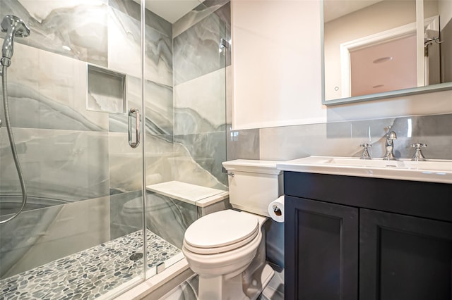 714 Montauk, West Islip, NY 11795 - bathroom with tile walls, a stall shower, vanity, and tasteful backsplash