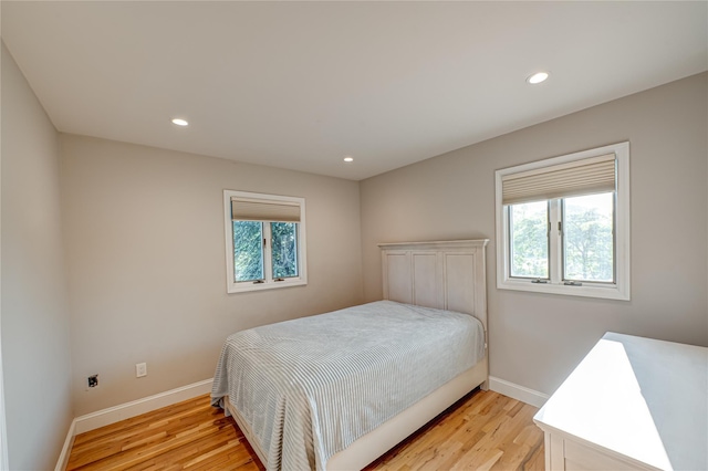 714 Montauk, West Islip, NY 11795 - bedroom with multiple windows, light wood-type flooring, and recessed lighting
