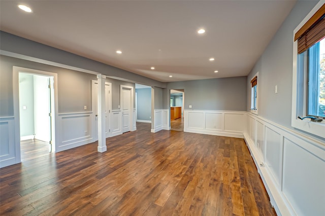 714 Montauk, West Islip, NY 11795 - empty room featuring recessed lighting, a decorative wall, dark wood-style flooring, and a wainscoted wall