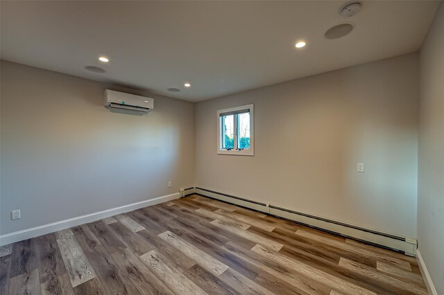 714 Montauk, West Islip, NY 11795 - empty room featuring a wall mounted air conditioner, baseboard heating, recessed lighting, wood finished floors, and a smoke detector