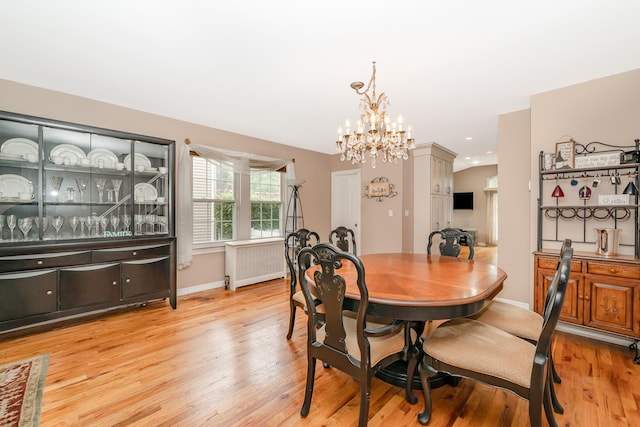 40 Syracuse St, Williston Park, NY 11596 - dining room with radiator heating unit, light wood-type flooring, a chandelier, and recessed lighting