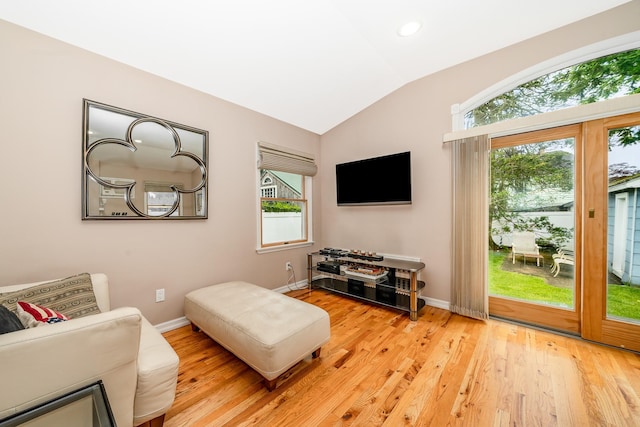 40 Syracuse St, Williston Park, NY 11596 - living room featuring vaulted ceiling, plenty of natural light, light wood-style flooring, and recessed lighting