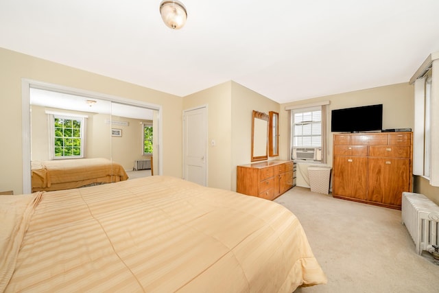 40 Syracuse St, Williston Park, NY 11596 - bedroom featuring cooling unit, radiator, and light colored carpet
