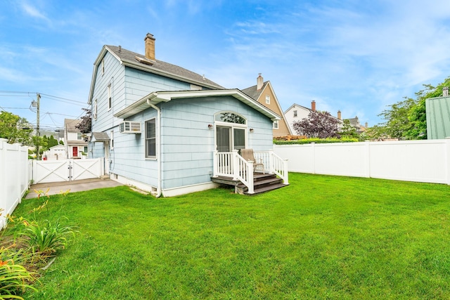 40 Syracuse St, Williston Park, NY 11596 - rear view of property featuring a fenced backyard, a gate, and a chimney