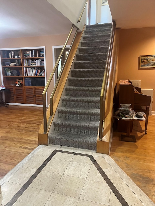 319 Mill Rd, Hewlett, NY 11557 - stairway with inlaid floor details and wood finished floors