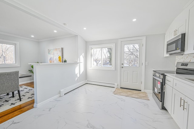 7 Felms Ct, Bethpage, NY 11714 - kitchen featuring stainless steel appliances, white cabinets, recessed lighting, light marble finish flooring, and baseboard heating