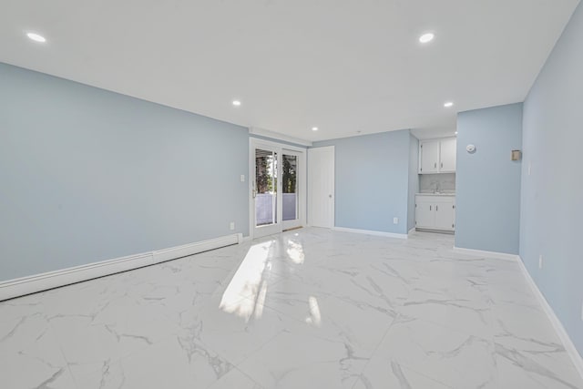 7 Felms Ct, Bethpage, NY 11714 - empty room with recessed lighting, light marble finish flooring, and a baseboard radiator