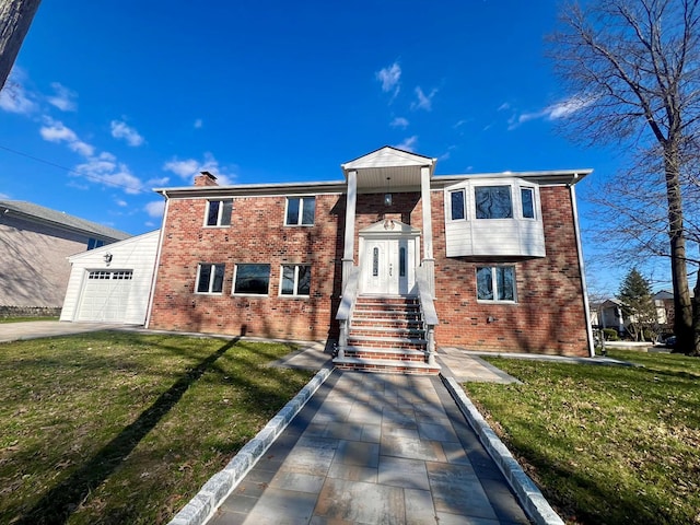 3245 210th St, Bayside, NY 11361 - view of front of home with brick siding, a front yard, a chimney, and an attached garage