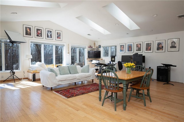 15 Cox Dr, Warwick, NY 10950 - dining room with a skylight, vaulted ceiling, and light wood-type flooring