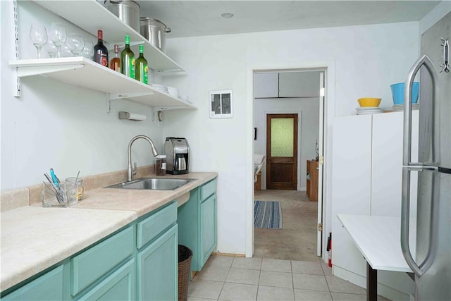 15 Cox Dr, Warwick, NY 10950 - kitchen featuring open shelves, freestanding refrigerator, light countertops, light tile patterned floors, and light carpet