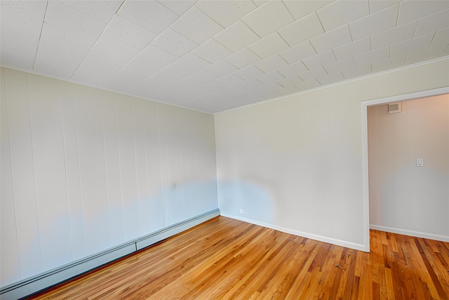 926 9th St, West Babylon, NY 11704 - spare room featuring a baseboard radiator and light wood-style flooring
