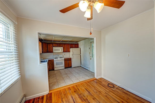 926 9th St, West Babylon, NY 11704 - kitchen with white appliances, light wood finished floors, a ceiling fan, a baseboard radiator, and light countertops
