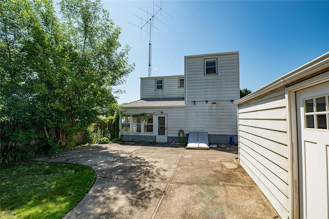 926 9th St, West Babylon, NY 11704 - back of house with a patio area and a shingled roof