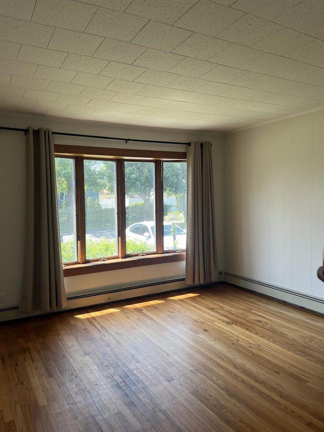 926 9th St, West Babylon, NY 11704 - unfurnished room featuring wood finished floors