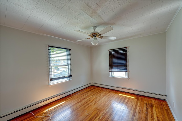 926 9th St, West Babylon, NY 11704 - empty room featuring ornamental molding, a baseboard radiator, wood-type flooring, and a ceiling fan