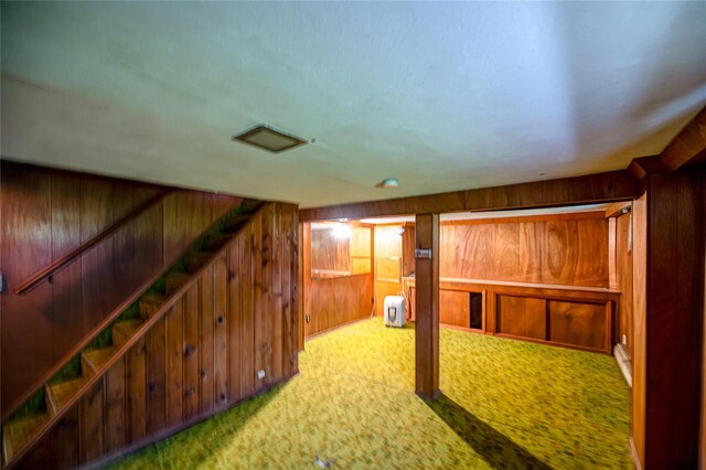 926 9th St, West Babylon, NY 11704 - finished basement featuring wooden walls, carpet, and stairs