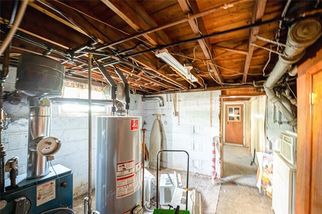 926 9th St, West Babylon, NY 11704 - basement with gas water heater, concrete block wall, and a heating unit