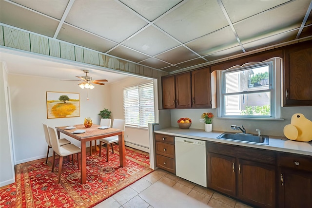 926 9th St, West Babylon, NY 11704 - kitchen with white dishwasher, light countertops, healthy amount of natural light, and light tile patterned floors