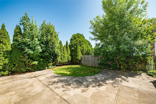 926 9th St, West Babylon, NY 11704 - fenced backyard with a patio area