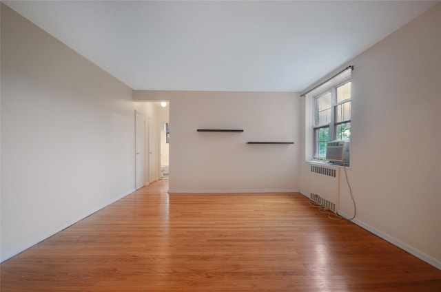 790 Bronx River Rd Unit A31, Bronxville, NY 10708 - empty room with radiator, light wood-style floors, and cooling unit