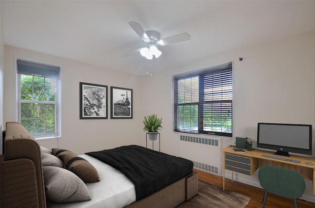 790 Bronx River Rd Unit A31, Bronxville, NY 10708 - bedroom with radiator, wood finished floors, and a ceiling fan