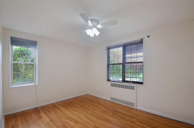790 Bronx River Rd Unit A31, Bronxville, NY 10708 - empty room featuring radiator, light wood-style flooring, and ceiling fan