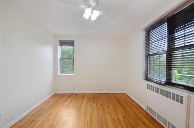 790 Bronx River Rd Unit A31, Bronxville, NY 10708 - unfurnished room with radiator, light wood-style flooring, and a ceiling fan