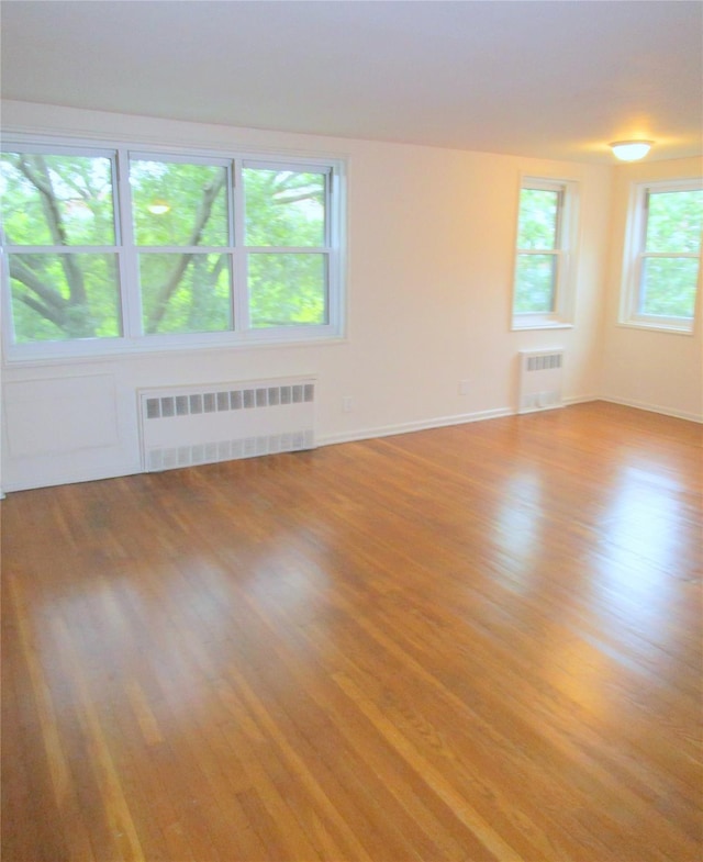 76 Dehaven Dr Unit 6B, Yonkers, NY 10703 - spare room with radiator and light wood-style floors