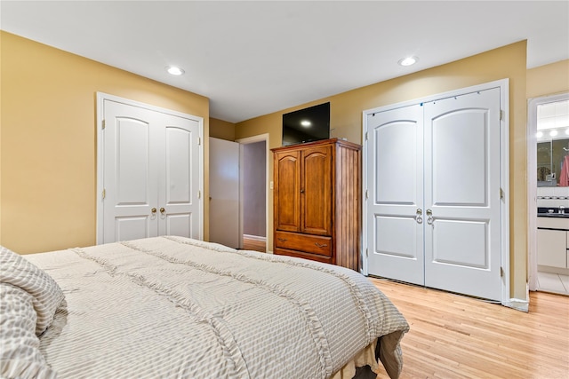 10 Cail Dr, East Rockaway, NY 11518 - bedroom with light wood-type flooring and recessed lighting