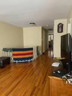 214-05 23rd Ave, Bayside, NY 11360 - hall with wood finished floors