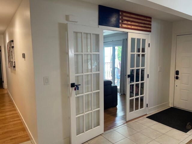 892 Skyline Dr Unit 892, Coram, NY 11727 - foyer entrance with french doors and light tile patterned flooring