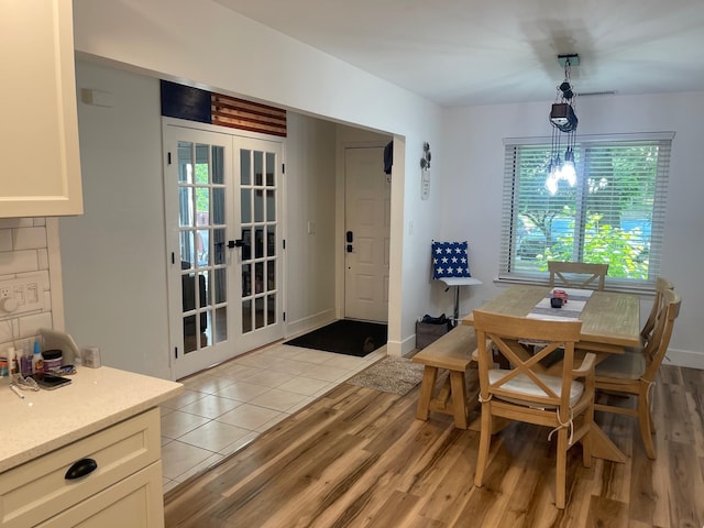 892 Skyline Dr Unit 892, Coram, NY 11727 - dining room with light wood-style flooring and french doors
