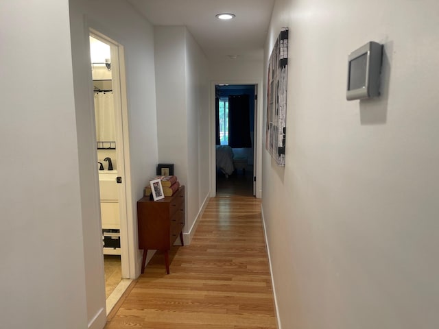 892 Skyline Dr Unit 892, Coram, NY 11727 - hallway with light wood-style floors and recessed lighting