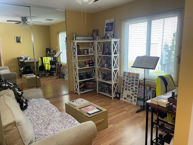 892 Skyline Dr Unit 892, Coram, NY 11727 - living area with ceiling fan, wood finished floors, and plenty of natural light