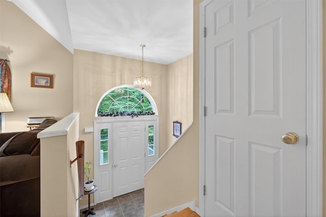 114 Bushwick Rd, Poughkeepsie, NY 12603 - foyer entrance with a chandelier and tile patterned flooring