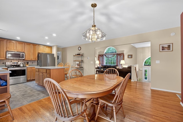 114 Bushwick Rd, Poughkeepsie, NY 12603 - dining room with a chandelier, light wood-type flooring, and recessed lighting