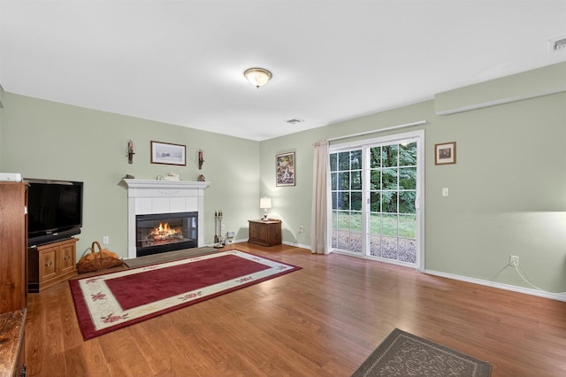 114 Bushwick Rd, Poughkeepsie, NY 12603 - unfurnished living room featuring wood finished floors and a fireplace