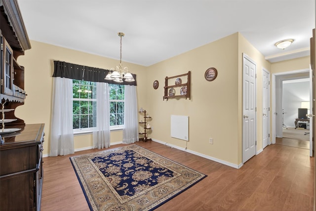 114 Bushwick Rd, Poughkeepsie, NY 12603 - dining room with a chandelier and light wood-type flooring