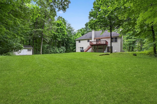 114 Bushwick Rd, Poughkeepsie, NY 12603 - view of grassy yard featuring stairs, a deck, and an outbuilding