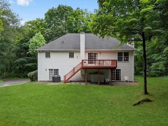 114 Bushwick Rd, Poughkeepsie, NY 12603 - rear view of house with a chimney, a deck, stairs, and a lawn