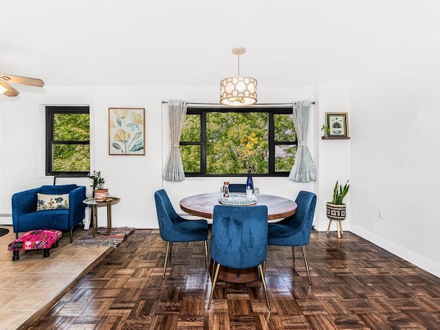 505 Central Ave Unit 618, White Plains, NY 10606 - dining space featuring plenty of natural light, a ceiling fan, and a baseboard heating unit