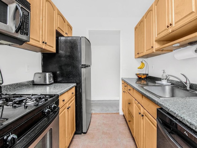 505 Central Ave Unit 618, White Plains, NY 10606 - kitchen featuring stainless steel microwave, range with gas stovetop, dishwasher, light tile patterned floors, and light brown cabinetry