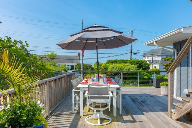 66 Hawser Dr, Oak Beach, NY 11702 - wooden deck with outdoor dining area