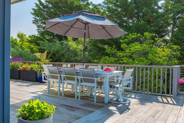 66 Hawser Dr, Oak Beach, NY 11702 - wooden terrace featuring outdoor dining area